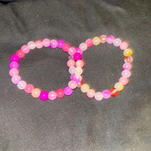 Bundle of pink bracelets. Different shades